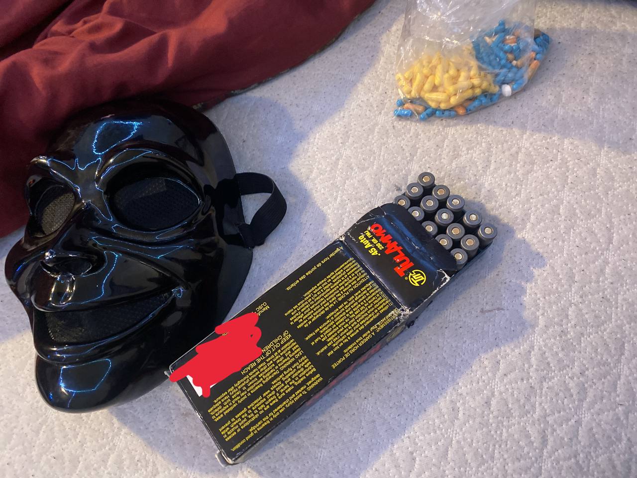 A photo of a mask and ammunition uploaded to a group chat where data access is advertised.